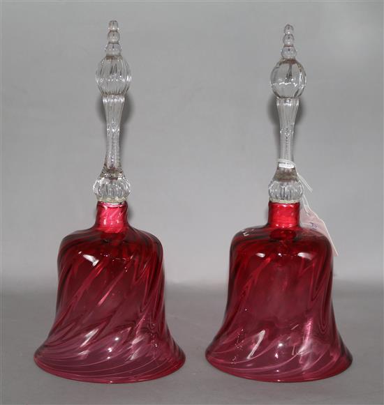 A pair of cranberry glass hand bells